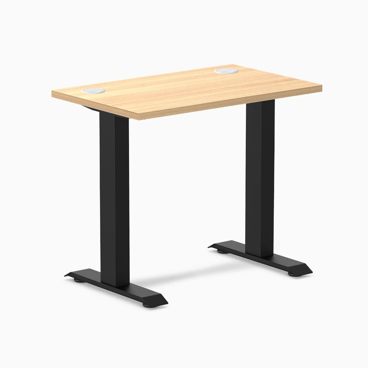 Desky Zero Mini sit-stand desk, 32x20 Sublime Teak top with grommets, matte black fixed-height legs.
