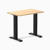Desky Zero Mini sit-stand desk, 32x20 Sublime Teak top with grommets, matte black fixed-height legs.