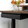Black steel Desky Under Desk Drawer mounted beneath a dark wood desk.