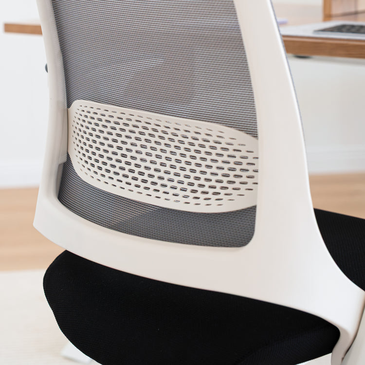 Close-up of Desky Pulse desk chair back with white frame, grey mesh, and white lumbar support.