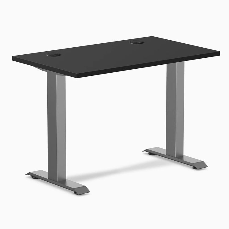 Desky Zero Mini fixed-height desk with black 40x24 inch top, space gray legs, and two grommets.