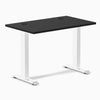 Desky Zero Mini fixed-height desk with black 40x24 inch top, white legs, and two grommets.