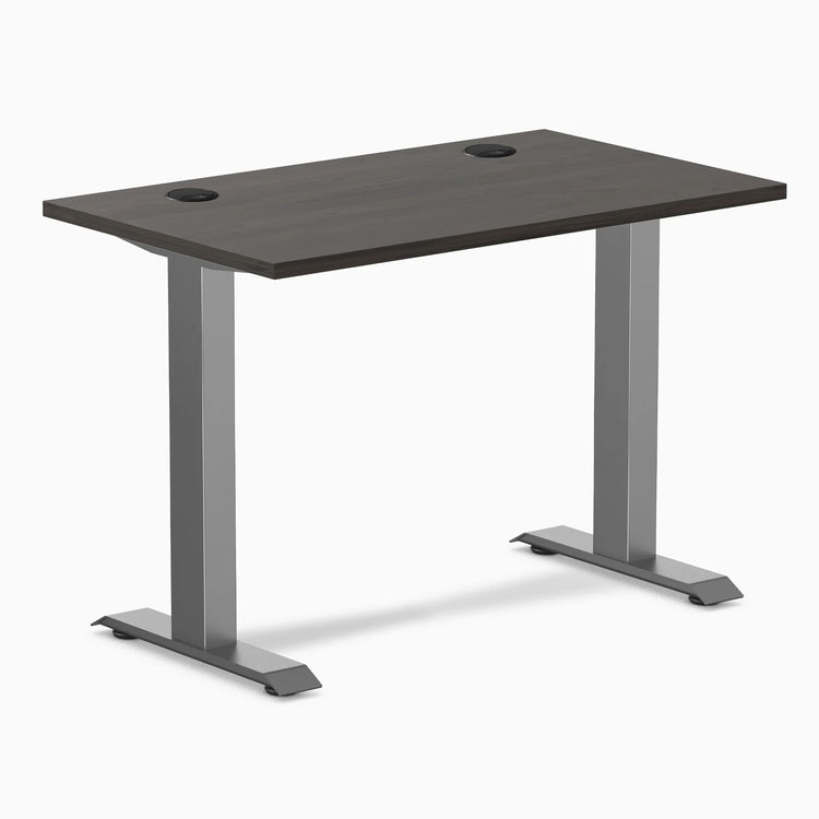 Desky Zero Mini fixed-height desk with burnished wood top, 40x24 inches, grommets, and space gray legs.