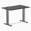 Desky Zero Mini fixed-height desk with burnished wood top, 40x24 inches, grommets, and space gray legs.
