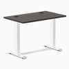 Desky Zero Mini fixed-height desk with burnished wood top, white legs, and two grommets.