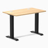 Desky Zero Mini fixed-height desk with Sublime Teak 40x24 inch top, grommets, and matte black legs.