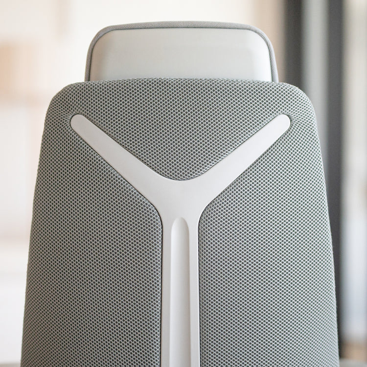 Close-up of Desky Pinnacle Executive Office Chair's light grey mesh backrest with white honeycomb structure and headrest.