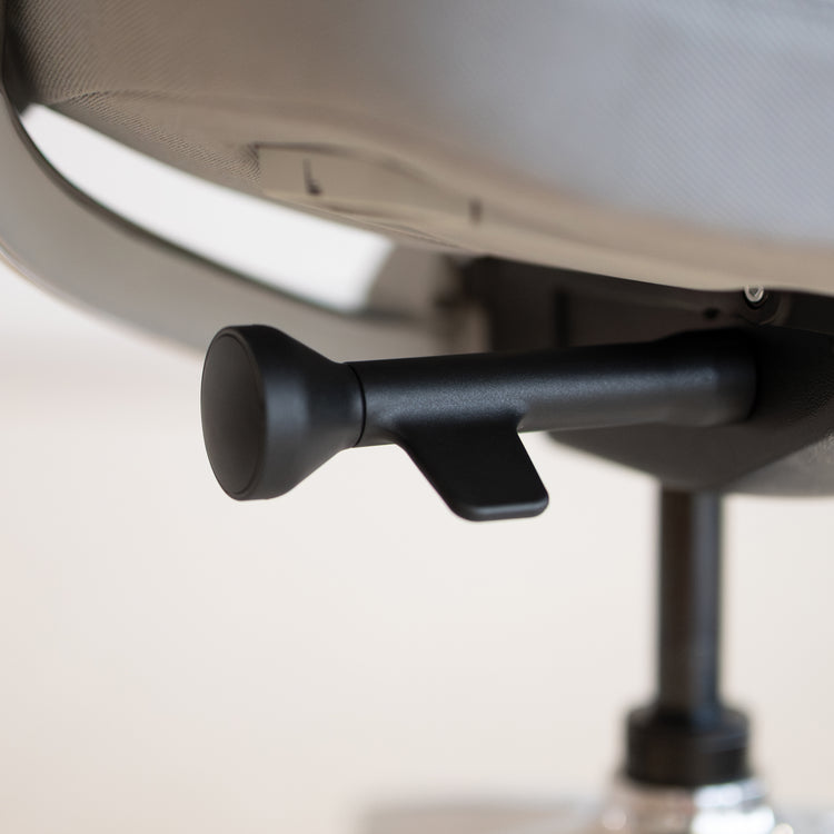 Close-up of the black Italian Donati seat tilt mechanism on the Desky Pinnacle Executive Office Chair.