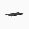 Black 47.2" x 29.5" laminate desktop with two grommets, 1" thick.