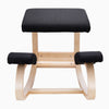 Desky Kneeling Chair with light beechwood frame and black mesh cushions.
