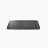 Black rectangular anti-fatigue standing mat with a rugged surface and bevelled edges.