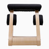 Desky Kneeling Chair with light beechwood frame and black mesh cushions.