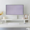 White Desky Minimal Monitor Stand made of melamine, elevating a monitor on a clean, organized desk.