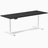 Black 78.7 x 29.5 inch Desky sit-stand gaming desk with white legs and two grommets.