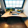 Desky Zero Ergo Edge Office Desk with a bamboo top, chamfered edge, and black steel frame.