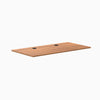 Desky Prime Oak laminate desktop, 59.1" x 29.5", with two black grommets.