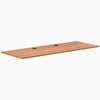 Prime Oak laminate desk top, 78.7" x 29.5", with two black grommets for cable management.