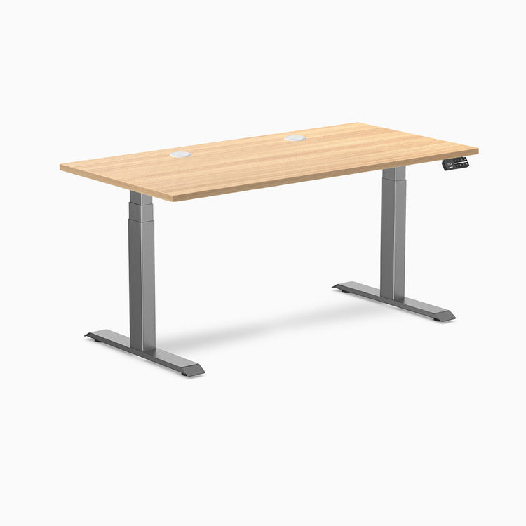 Desky Dual sit-stand desk with Sublime Teak laminate top, two grommets, and Space Gray frame.
