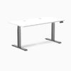 Desky Dual Laminate Sit Stand Desk with white top, space gray frame, and two grommets.