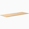 Desky Sublime Teak laminate desktop, 78.7 x 29.5 inches, with two white grommets.