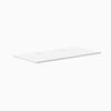 White Desky laminate desktop, 59.1" x 29.5", with two grommets for cable management.