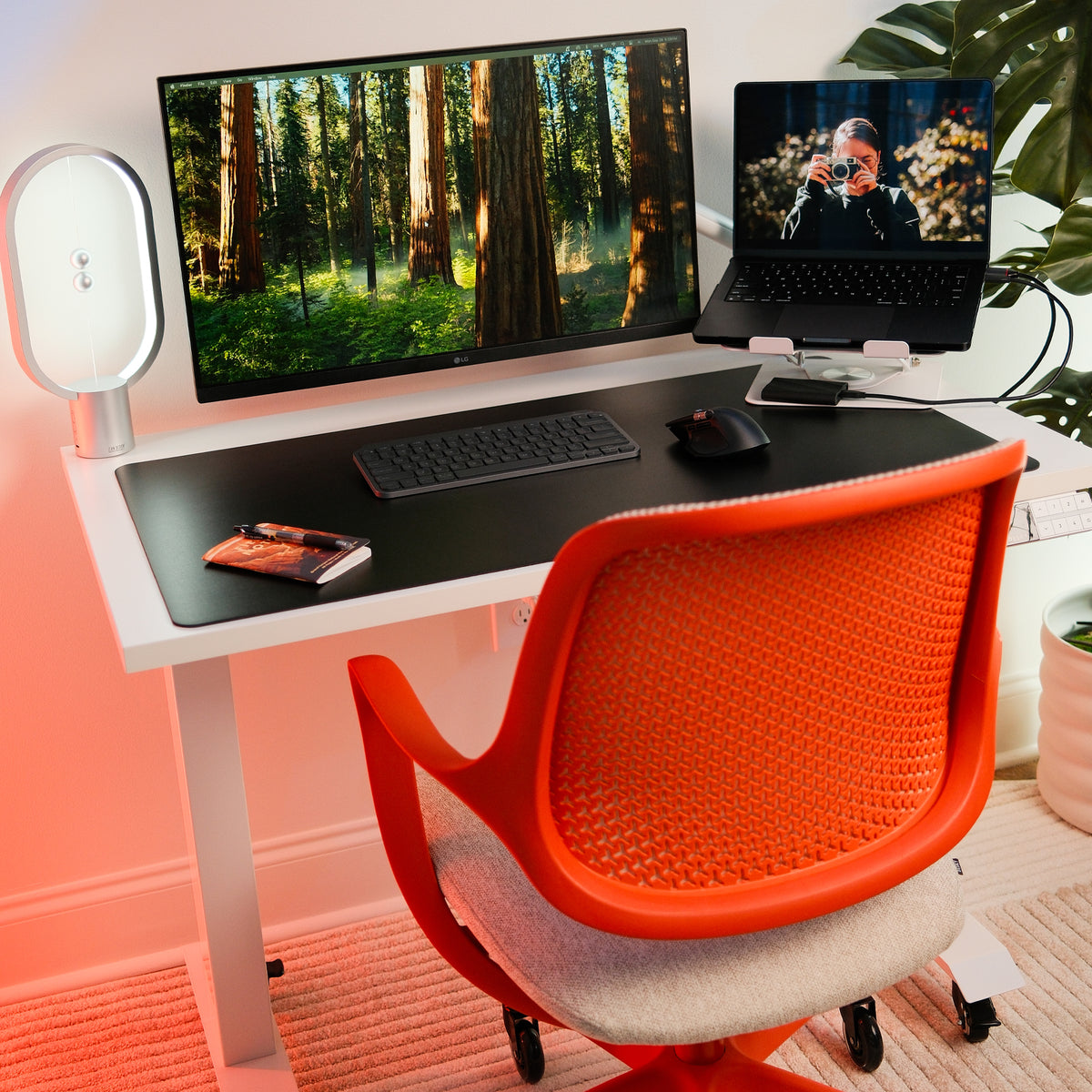 Desky Dual Mini Sit Stand Desk in White with an orange office chair