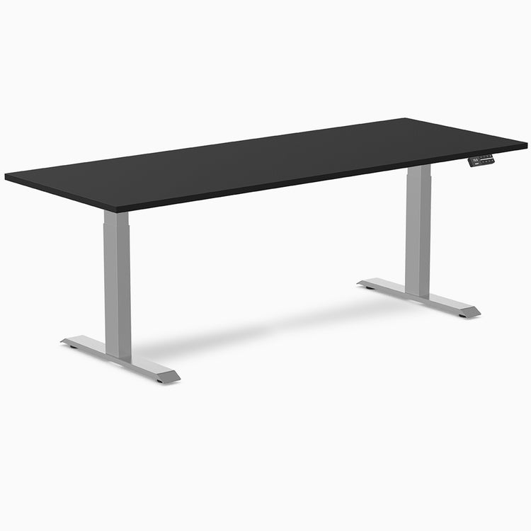 Desky Dual black laminate sit-stand desk with silver frame and digital control panel.