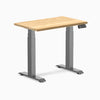 Desky Dual Mini Hardwood Sit Stand Desk with White Oak top and Space Gray frame.