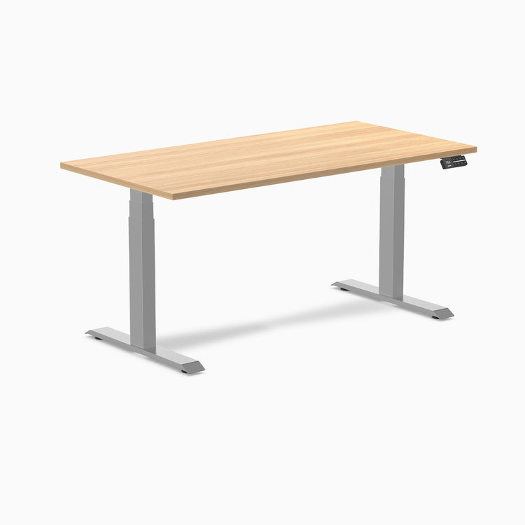 Light wood laminate sit-stand desk with silver frame and digital control panel.