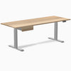 Desky Dual hardwood standing desk, white ash top, gray legs, and matching under-desk drawer.