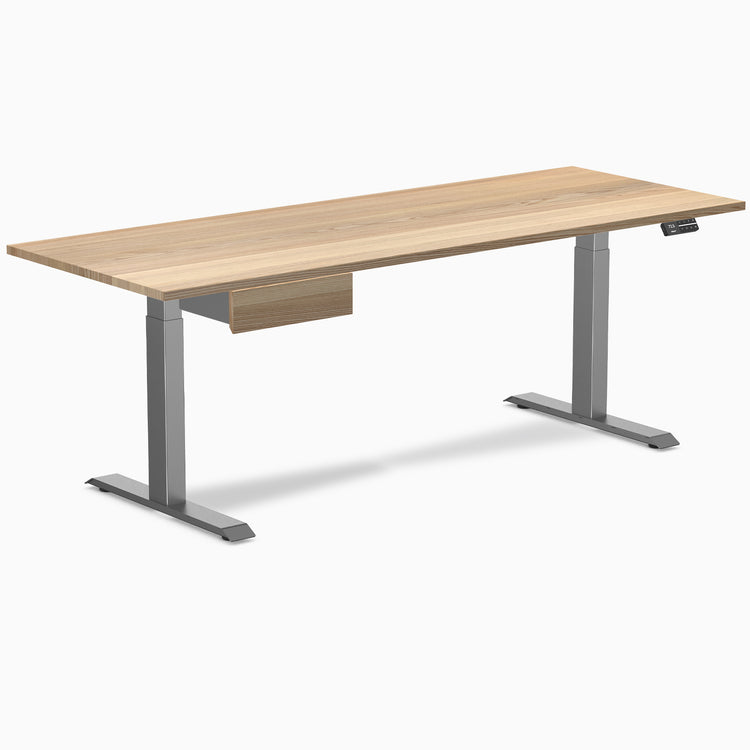 Desky Dual hardwood standing desk, white ash top, space gray legs, and matching under-desk drawer.