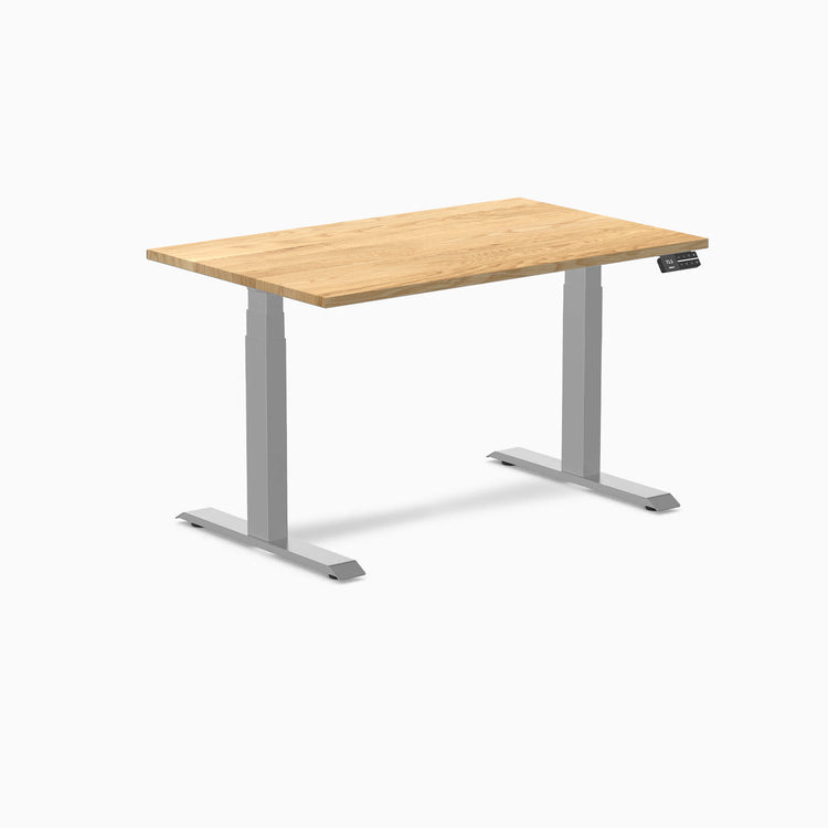 Desky Dual 48x30 inch White Oak hardwood sit-stand desk with gray legs and control panel.