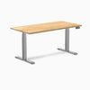 Desky Dual 60x30 inch White Oak hardwood sit-stand desk with Space Gray legs and control panel.