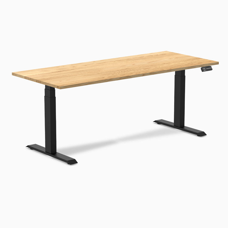 Desky Dual Hardwood Sit Stand Desk with a White Oak top and Matte Black legs.