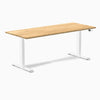 Desky Dual 72x30 inch White Oak hardwood sit-stand desk with white legs and control panel.