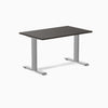 Desky Zero laminate office desk with a dark brown top and silver steel frame.