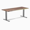 Desky Zero office desk with a rich Pheasantwood hardwood top and gray steel frame.