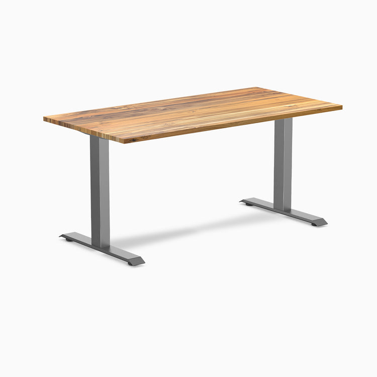 Desky Zero fixed-height office desk with Teak hardwood top and Space Gray steel frame.