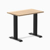 Desky Zero Mini hardwood desk with a light White Ash top and matte black steel frame.