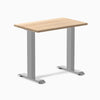 Desky Zero Mini hardwood desk with a White Ash top and gray steel frame.