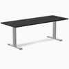 Desky Zero fixed height office desk with a black laminate top and silver steel T-frame legs.