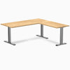 Desky Zero L-Shape Office Desk with White Oak hardwood top and Space Gray steel frame.