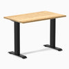 Desky Zero Mini hardwood office desk with a White Oak top and matte black steel frame.