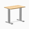 Desky Zero Mini hardwood desk with a White Oak top and gray steel frame.