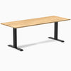 Modern Desky Zero office desk with White Oak hardwood top and matte black steel frame.